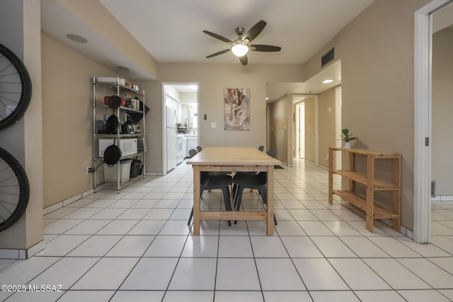 tiled dining room with ceiling fan