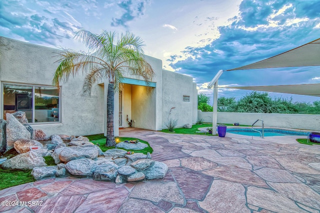 view of patio with a fenced in pool