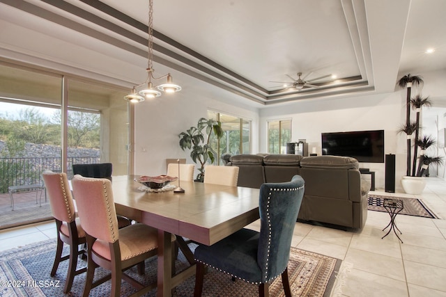 dining area featuring light tile patterned floors, plenty of natural light, and a ceiling fan