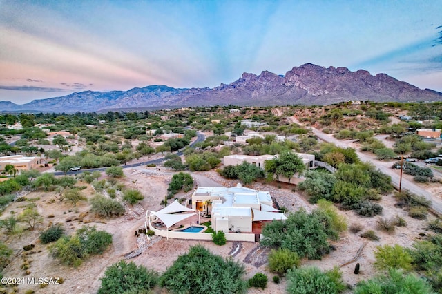 birds eye view of property with a mountain view