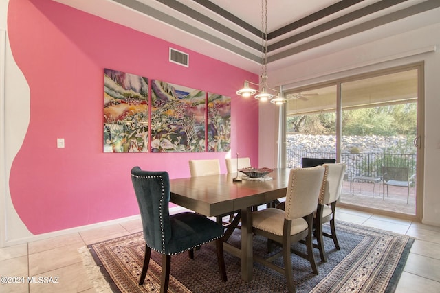 dining space featuring a chandelier, visible vents, and light tile patterned floors