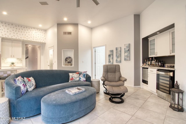 living area with wine cooler, visible vents, a dry bar, and light tile patterned floors