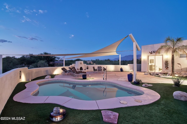 view of swimming pool featuring a fenced backyard, a lawn, a fenced in pool, and a patio