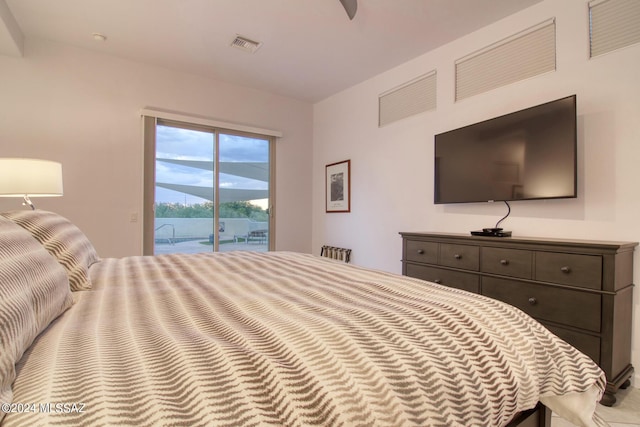 bedroom featuring access to outside and visible vents