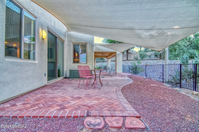 view of patio featuring fence