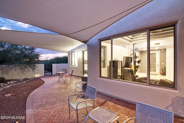 view of patio / terrace with visible vents and fence