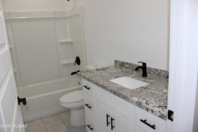 bathroom with toilet, marble finish floor, shower / washtub combination, and vanity