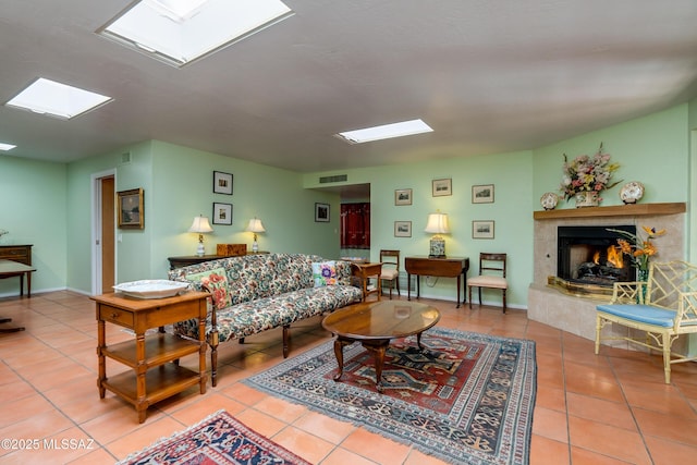 living room featuring tile patterned flooring and a fireplace