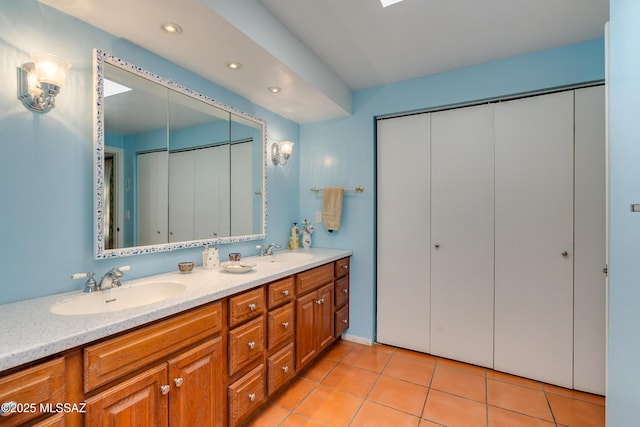 bathroom with vanity and tile patterned floors