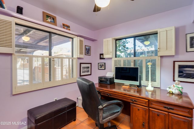 tiled home office featuring ceiling fan