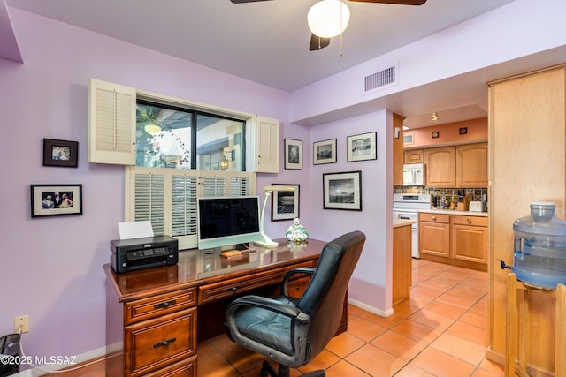 home office with ceiling fan and light tile patterned floors