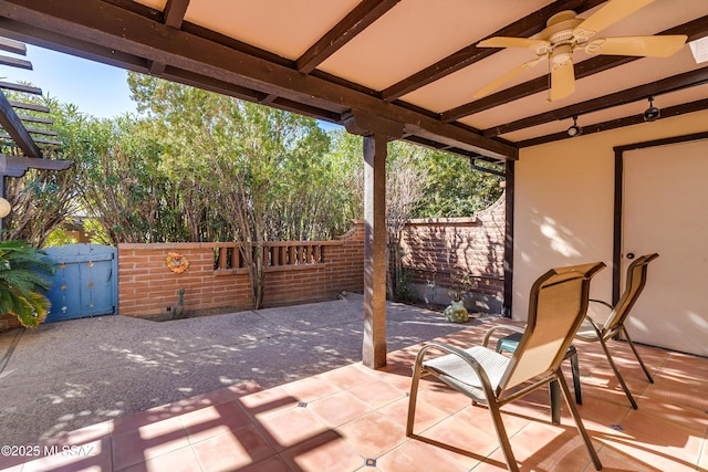 view of patio featuring ceiling fan