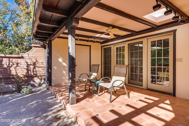 view of patio featuring ceiling fan