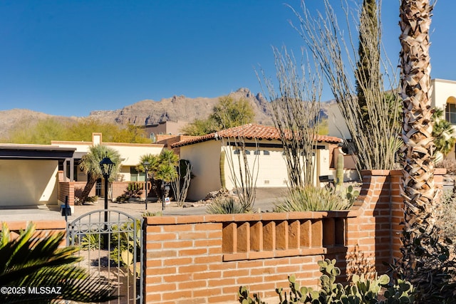 view of front of house featuring a mountain view and a garage