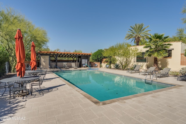 view of swimming pool with a pergola and a patio area