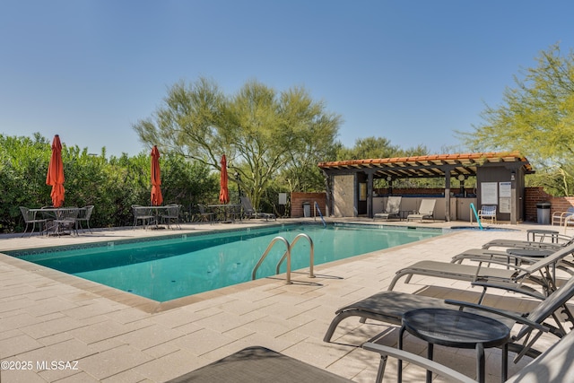 view of swimming pool with a patio