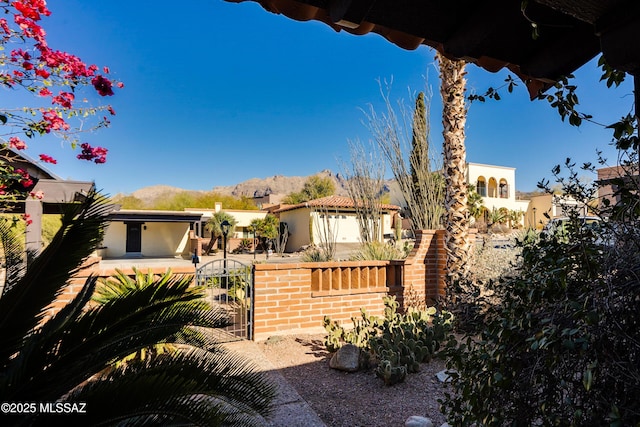 view of front of property with a mountain view