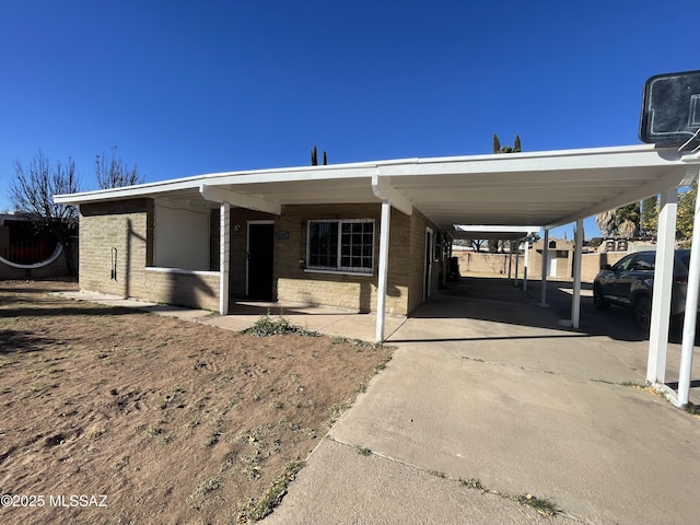 view of front of home with a carport