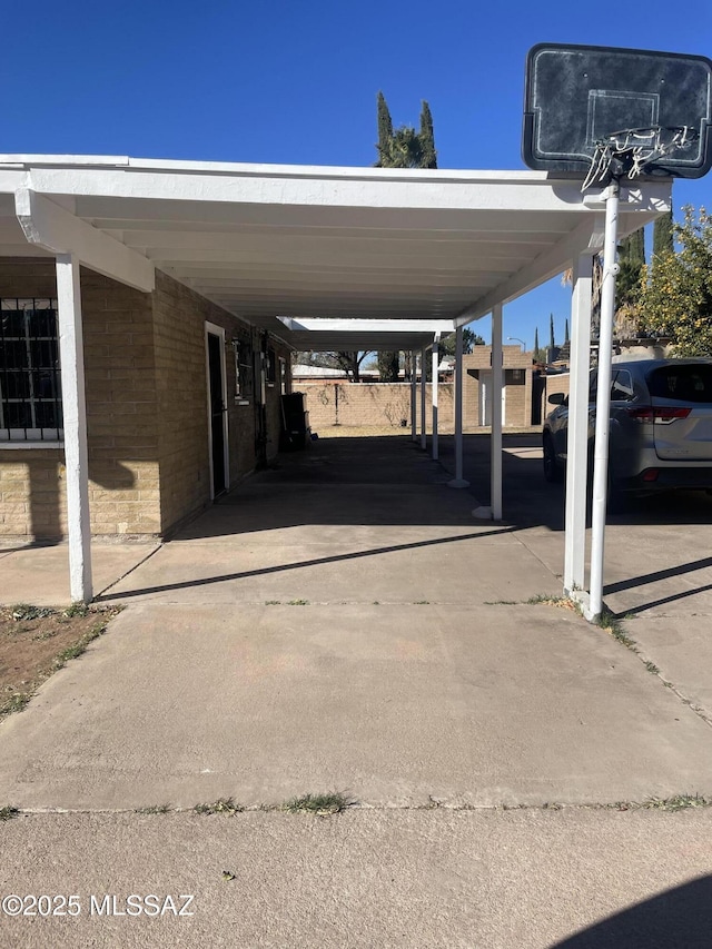 view of parking / parking lot with a carport