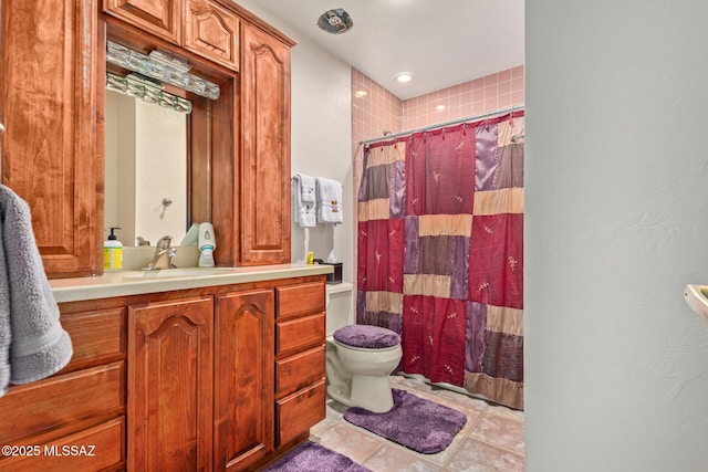 bathroom featuring tile patterned flooring, toilet, vanity, and a shower with shower curtain