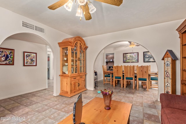 living room with ceiling fan