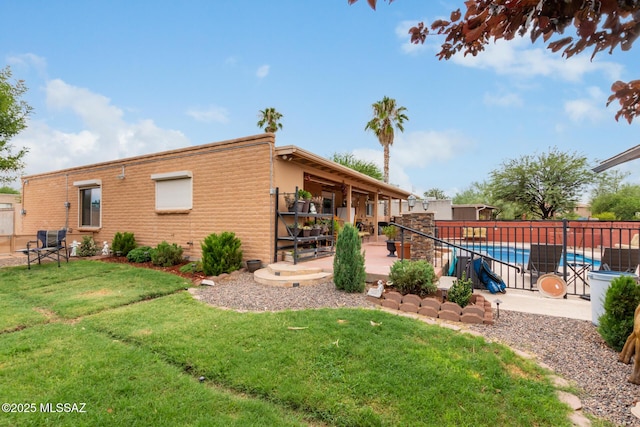 view of yard featuring a fenced in pool and a patio area