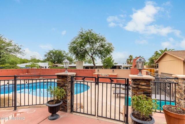 view of swimming pool with a patio area