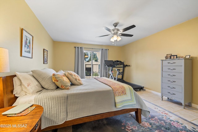 tiled bedroom with ceiling fan and access to exterior