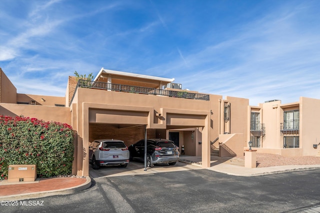 exterior space featuring a carport