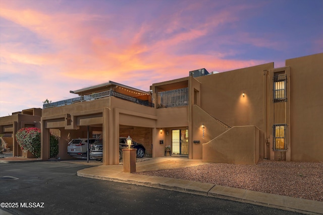 view of front of property with a carport