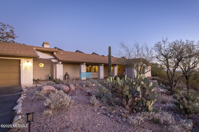 single story home featuring a garage