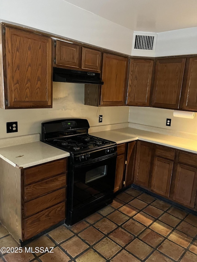 kitchen with dark brown cabinetry and black range with gas cooktop