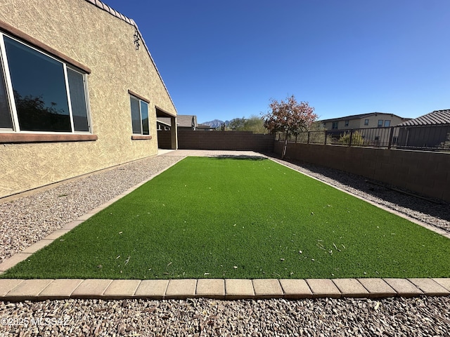 view of yard featuring a fenced backyard