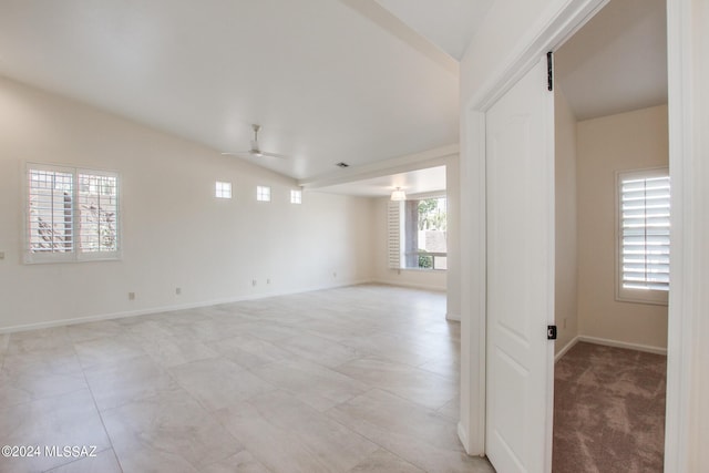 unfurnished room with ceiling fan and lofted ceiling