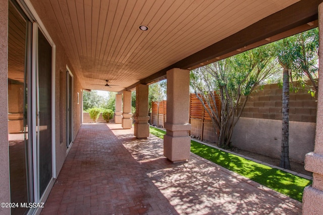 view of patio featuring ceiling fan