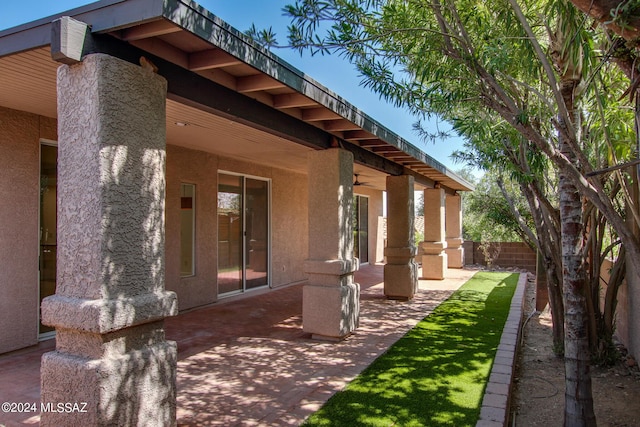 view of side of home with a patio