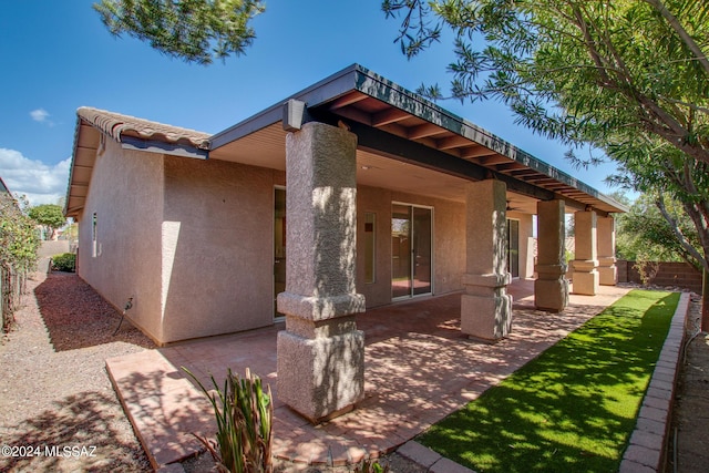 view of property exterior with a patio