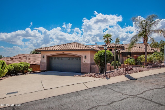 mediterranean / spanish-style home featuring a garage