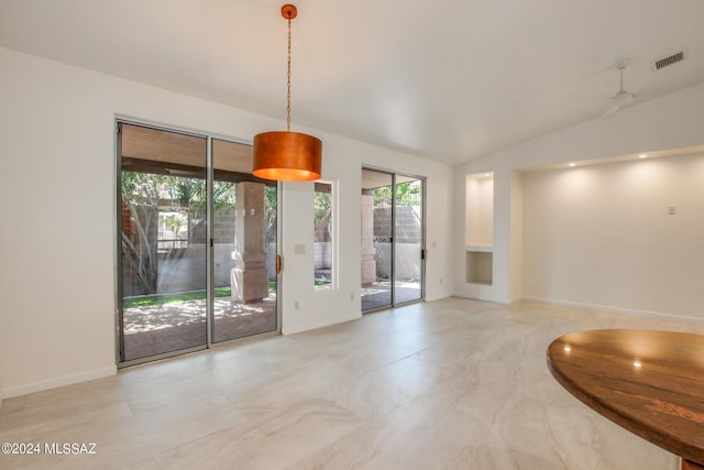 interior space featuring vaulted ceiling and ceiling fan