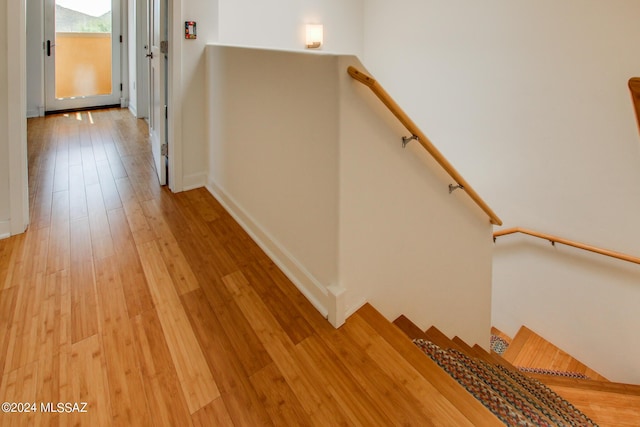 stairway with wood-type flooring