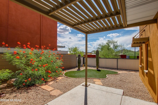 view of yard with a pergola and a patio