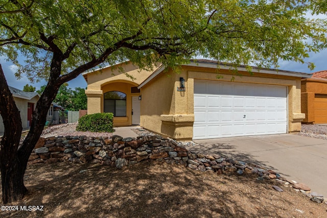 single story home featuring a garage