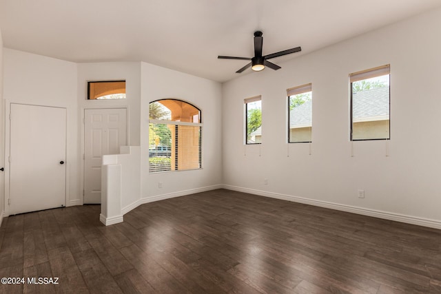 empty room with dark hardwood / wood-style floors and ceiling fan