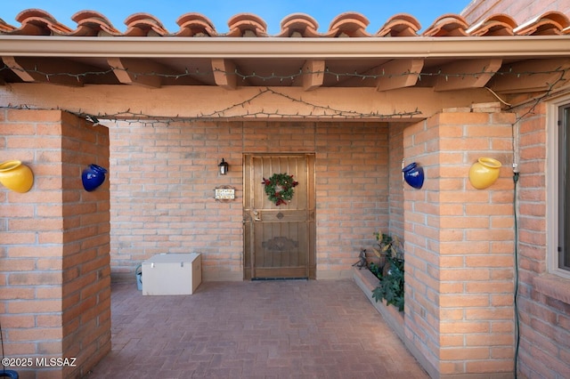 doorway to property with a patio area