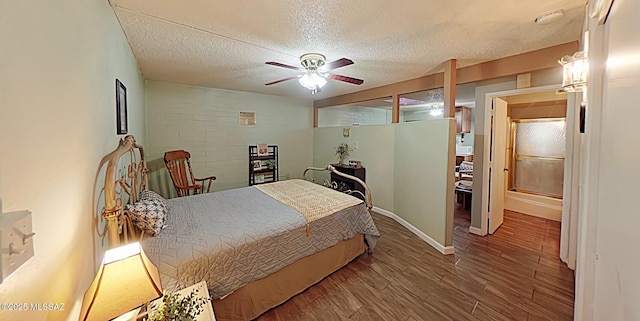 bedroom featuring ceiling fan, hardwood / wood-style floors, and a textured ceiling