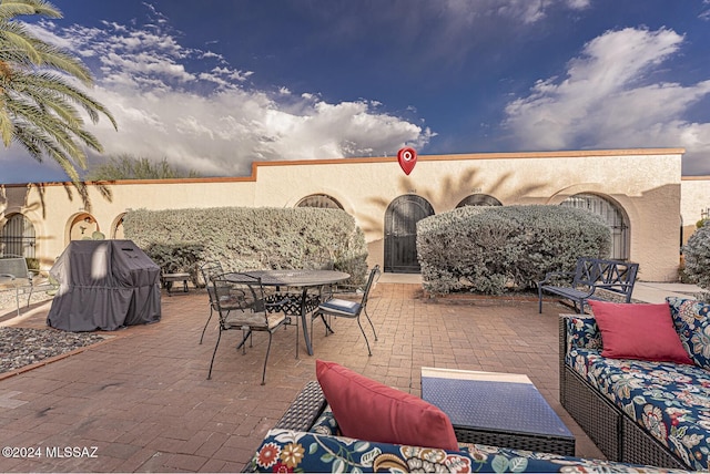 view of patio with an outdoor living space and area for grilling