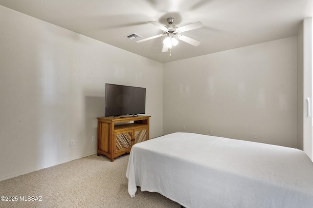 bedroom with light colored carpet and ceiling fan