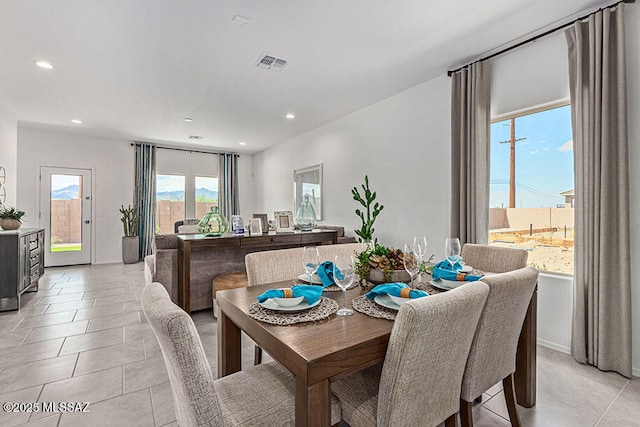 dining space with light tile patterned floors