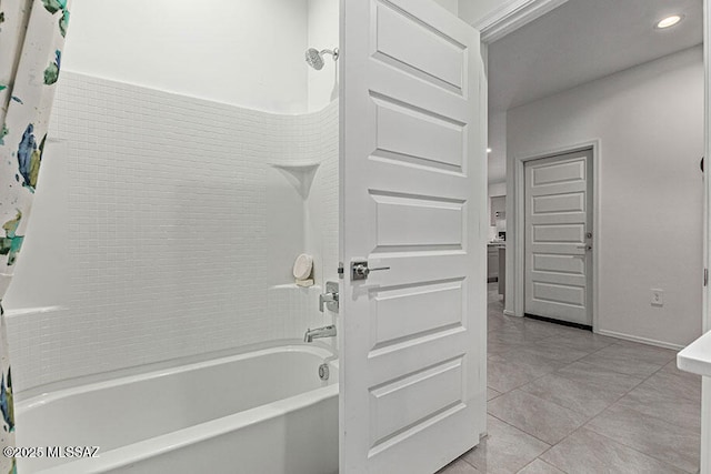 bathroom featuring tile patterned flooring and shower / tub combo