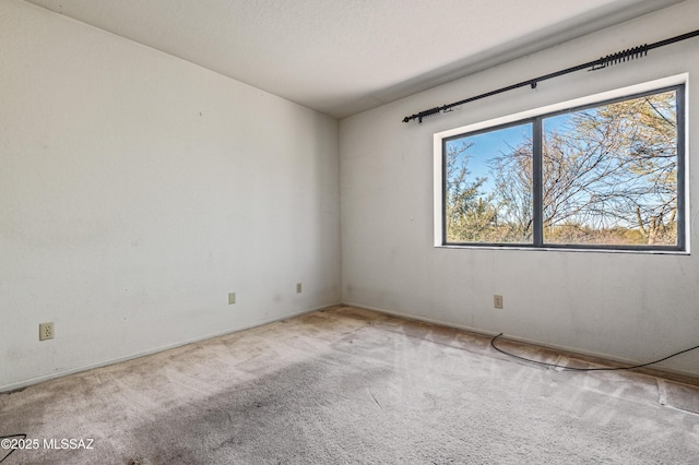 unfurnished room with carpet floors